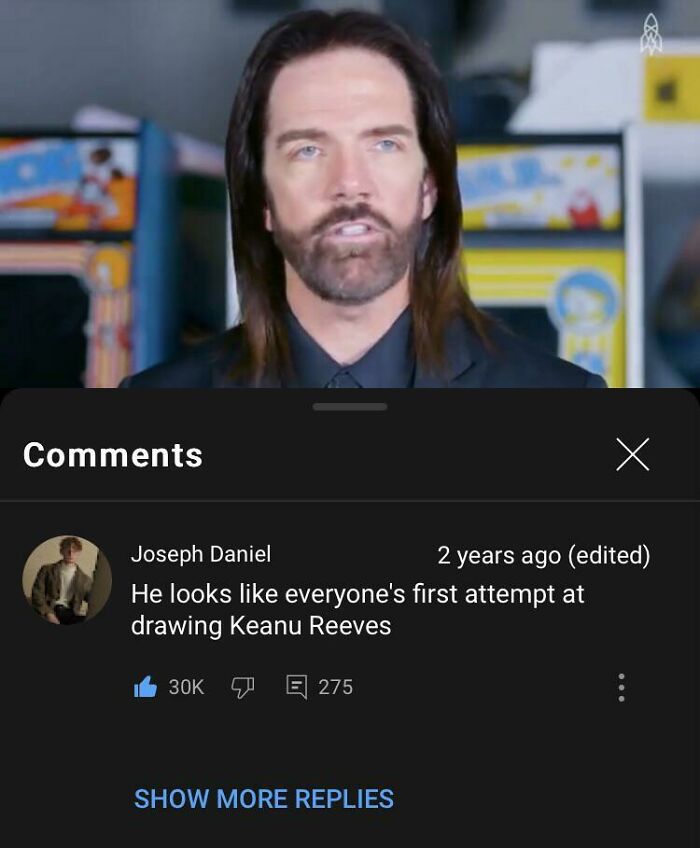 Man with long hair and beard shown above a humorous YouTube comment in a popular hilarious YouTube comments thread.