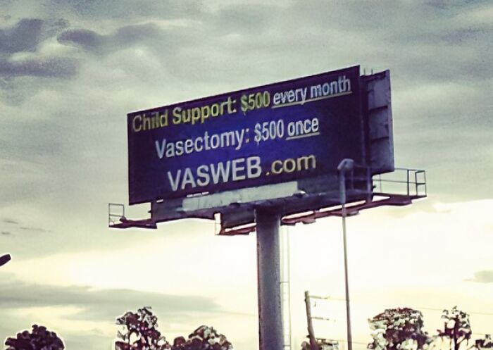 Funny and weird billboard advertising vasectomies with pricing, blending humor and bold marketing in an outdoor setting.