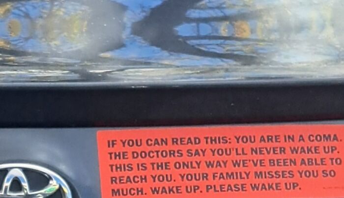 Red bumper sticker with a clever and emotional message seen on a car, demonstrating funny and clever bumper stickers on the road.
