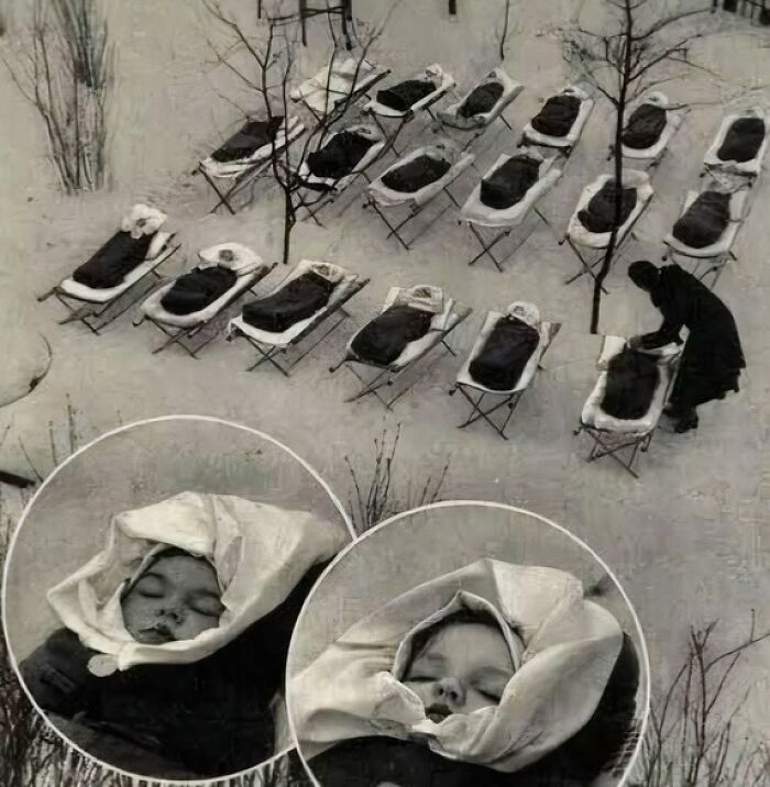 Black and white photo showing children lying on outdoor beds in winter, a fascinating image to see the world differently.