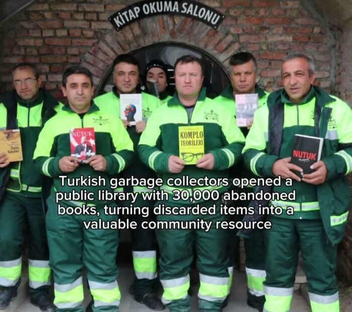 Group of men in bright uniforms holding books, representing men are good by creating a community library from discarded items.