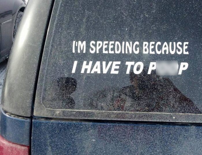 Funny bumper sticker on a dusty car window humorously explaining speeding spotted by drivers on the road.