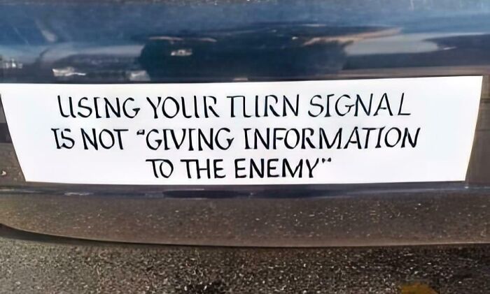 Bumper sticker humor about using turn signals, showcasing a clever and hilarious message snapped on the road.