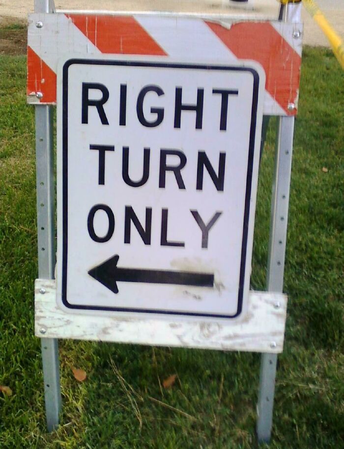Confusing road sign showing right turn only with an arrow pointing left, highlighting misleading road signs concept.