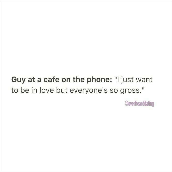 Guy at a cafe on the phone expressing frustration about dating and wanting to be in love despite challenges.