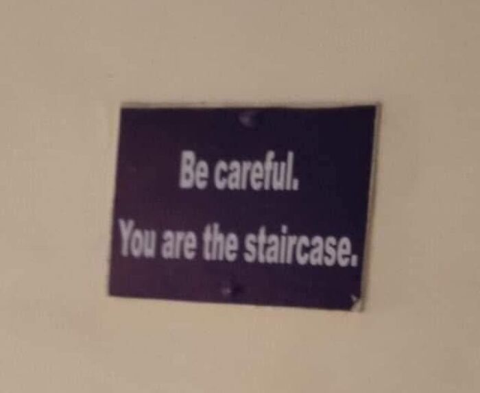 Humorous out of context sign reading Be careful You are the staircase related to pleasures of the occult theme.
