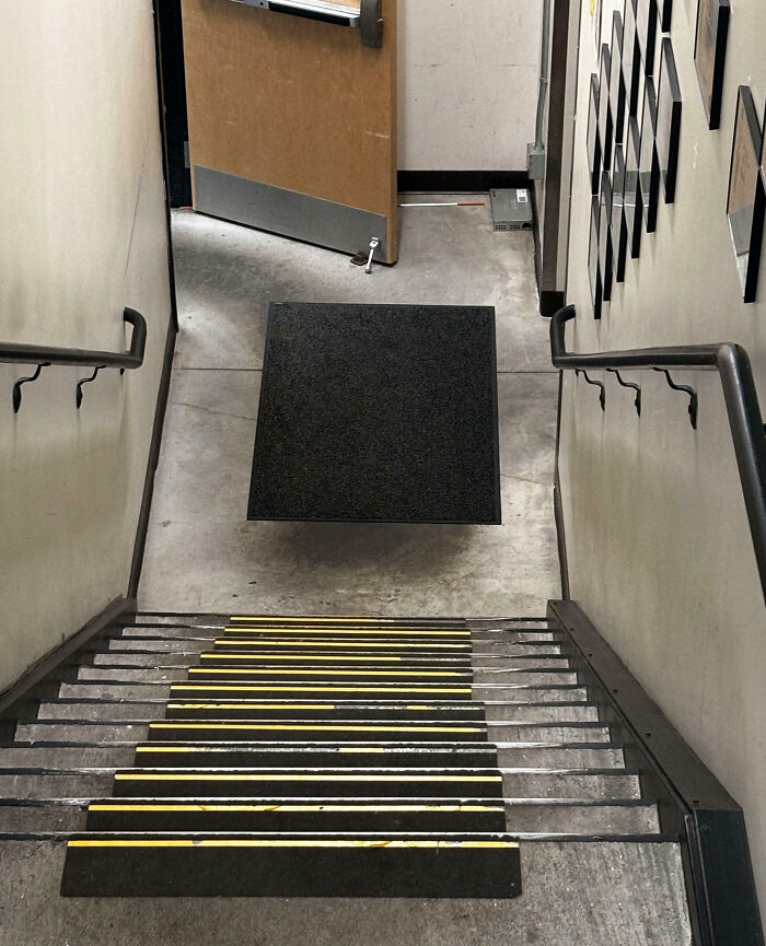 Floating black square mat at bottom of stairs creates an unphotoshopped pic that looks fake but is 100% real.