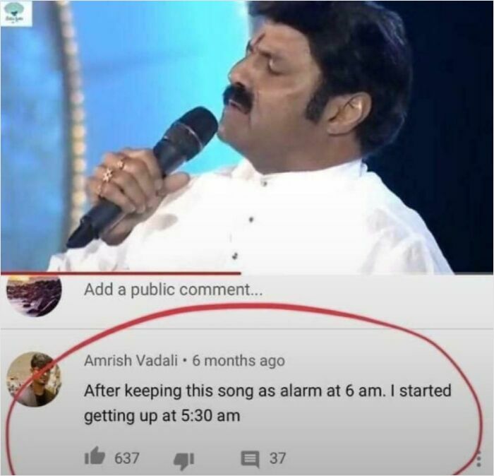 Man singing into a microphone with funny YouTube comment about waking up early using a song as alarm clock.