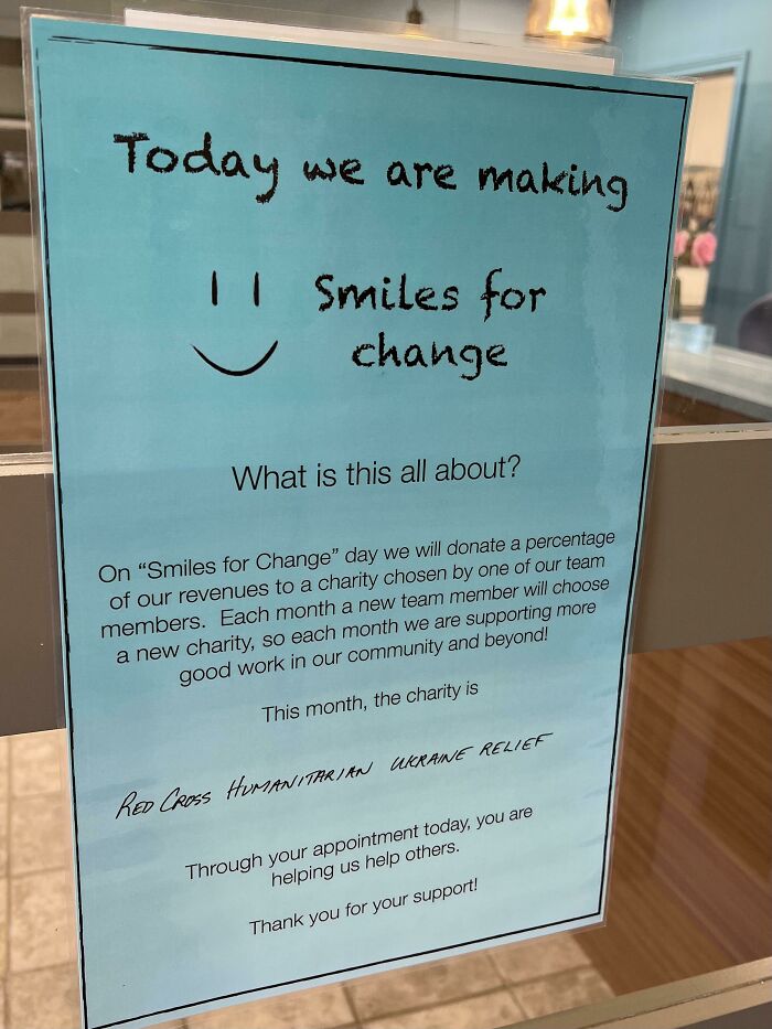 Sign explaining a doctor's office initiative to donate a percentage of revenues to charity, putting patients at ease.