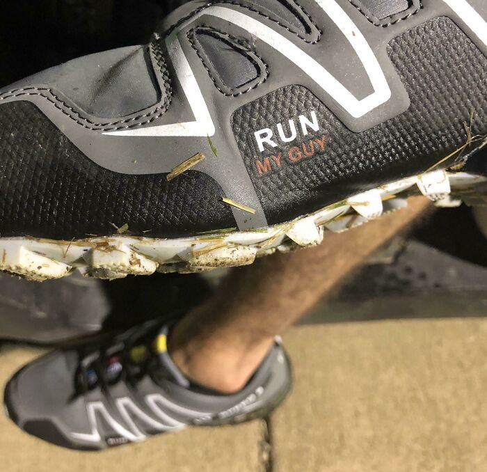 Close-up of a gray sneaker with a misspelled brand label showing careless online shopping backfired humor.