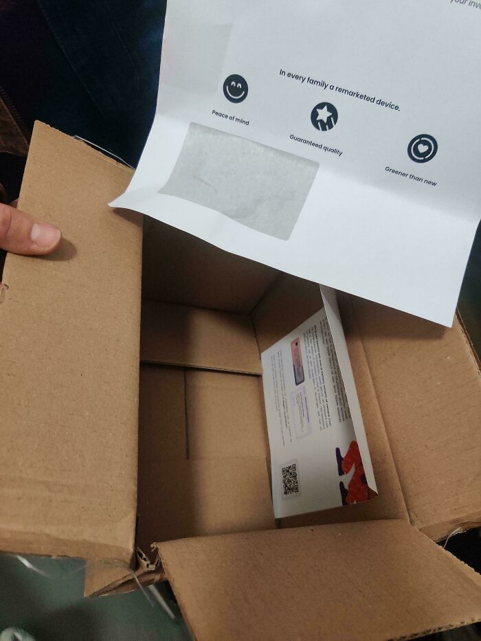 Empty cardboard box with product information papers inside, illustrating careless online shopping backfired moments.
