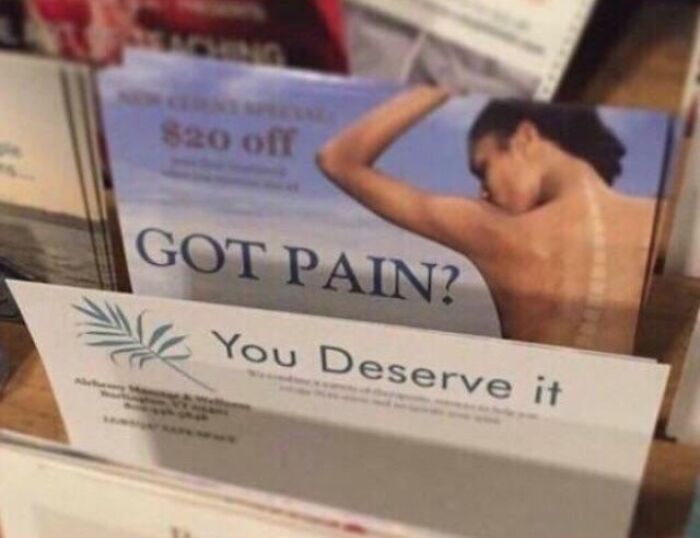 Brochure with a back pain ad showing a person's back and the text "Got Pain?" creating a hilarious accidental meme.