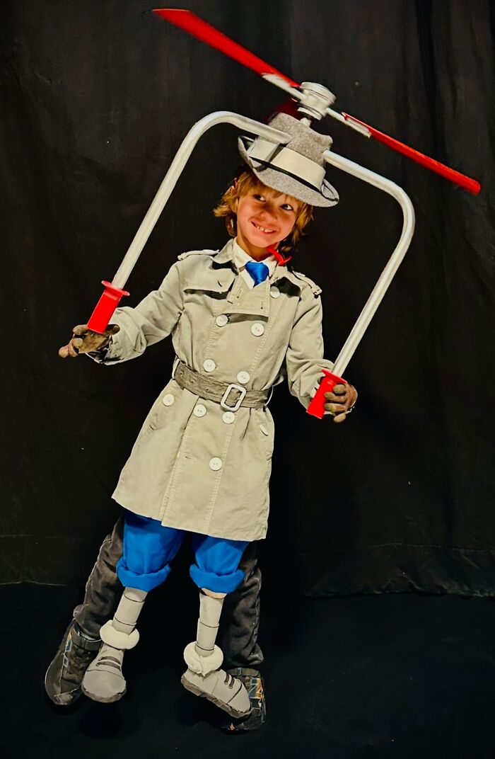 Child dressed in creative Halloween costume with helicopter hat and trench coat, showcasing amazing kids' Halloween costume ideas.
