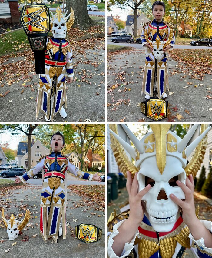 Child in an amazing kids Halloween costume holding a championship belt outdoors on a fall day with colorful leaves.