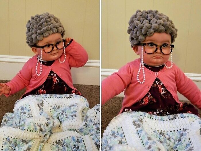 Toddler in an amazing kids' Halloween costume wearing a gray wig, glasses, pearls, and a floral dress with a pink cardigan.
