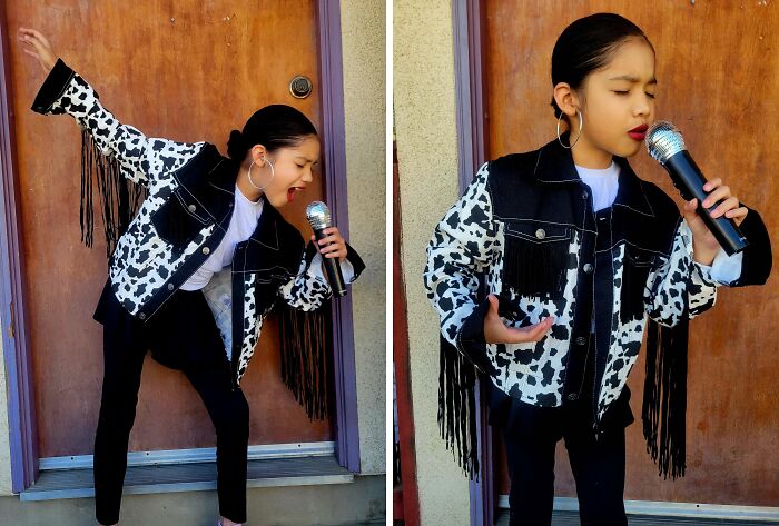 Child in cowboy-themed Halloween costume singing into a microphone, showcasing amazing kids Halloween costume ideas.