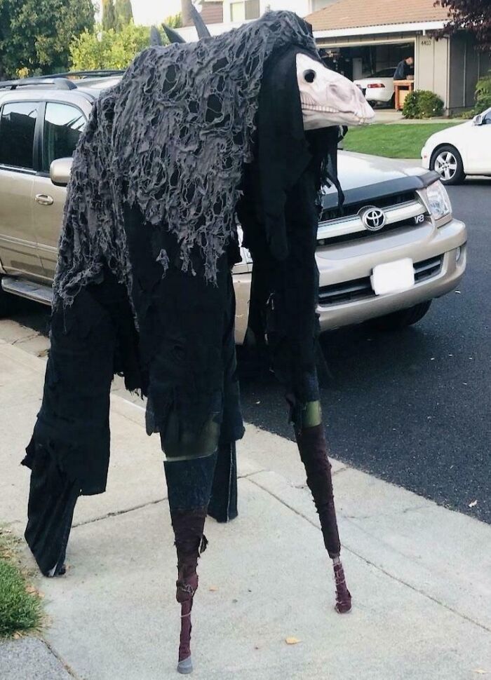 Kids' Halloween costume idea featuring a tall creature with a skeletal horse head and tattered black fabric.