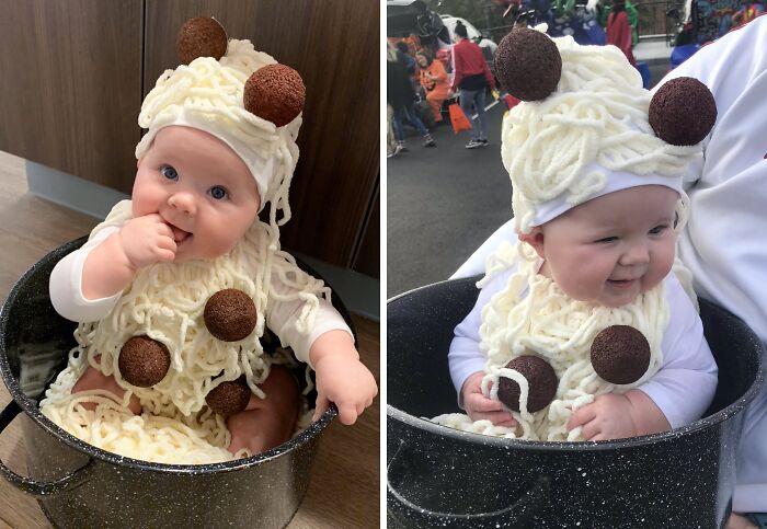 Baby dressed in a creative kids Halloween costume as a spaghetti and meatballs dish sitting inside a large cooking pot.