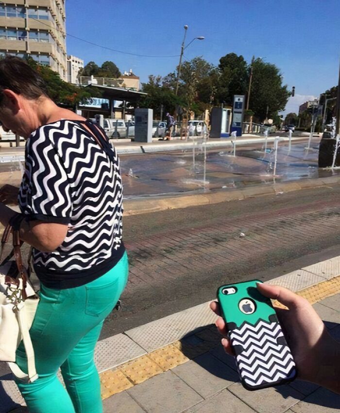 Woman wearing a top matching a phone case with a similar black and white zigzag pattern, creating a hilarious post meme.