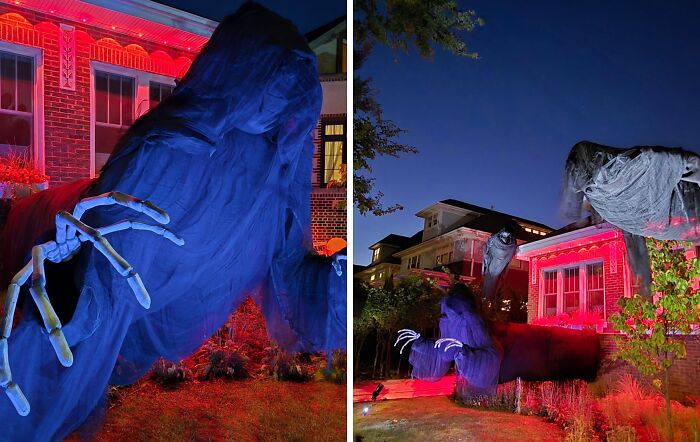 Large spooky outdoor Halloween decorations with glowing red lights and giant ghost figures on a residential lawn at night