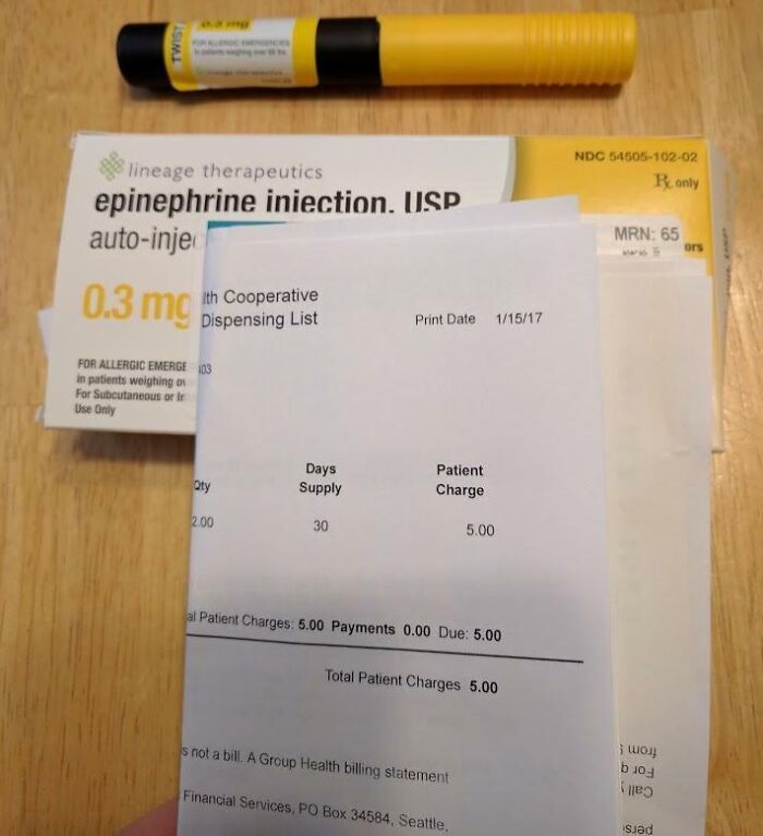 Epinephrine auto-injector and patient charge bill highlighting harsh realities of American healthcare costs.