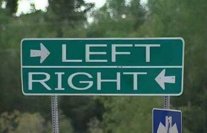 Confusing road sign showing directions with arrows pointing opposite ways for left and right, causing driver uncertainty.