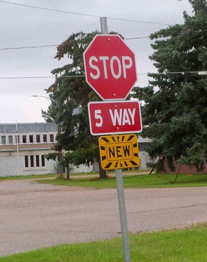 Confusing road sign showing a stop sign with an unusual 5 way intersection and a new addition below.