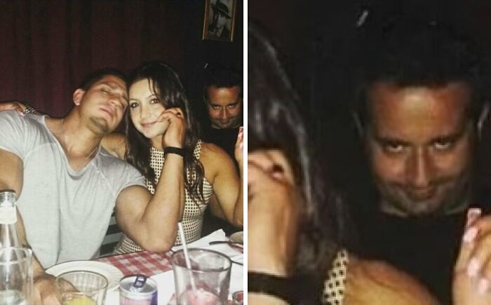 Couple posing happily at dinner with a man in the background photobombing, showcasing perfect photobombs in a social setting.