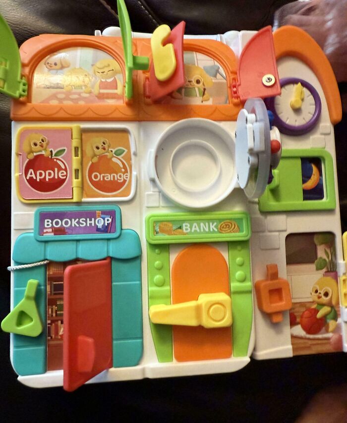 Colorful interactive toy with doors, windows, and labels that tested people’s patience with mild annoyances.