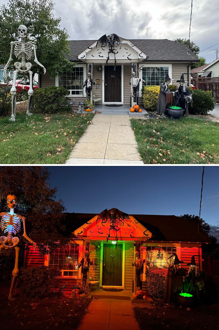 Outdoor Halloween decorations featuring skeletons, witches, bats, pumpkins, and eerie lighting on a decorated house front.