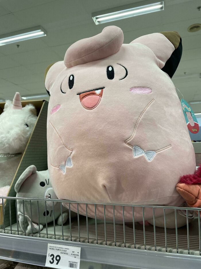 Large plush toy with a funny expression displayed on a store shelf showcasing accidental comedy in harmless pics.
