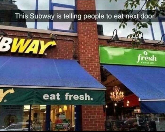 Subway sign humorously telling people to eat next door at a fresh food store in accidental comedy moment.
