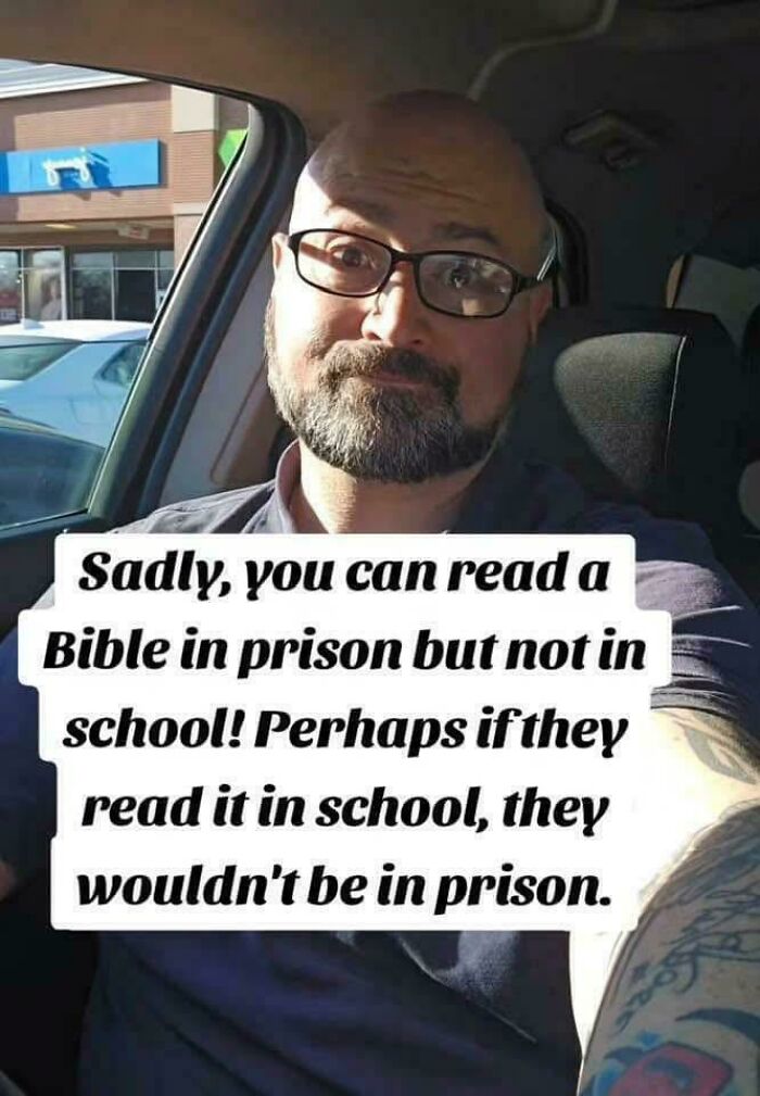 Man with glasses and beard in car, sharing a meme about reading the Bible and prison reflecting personal beliefs and memes shared.