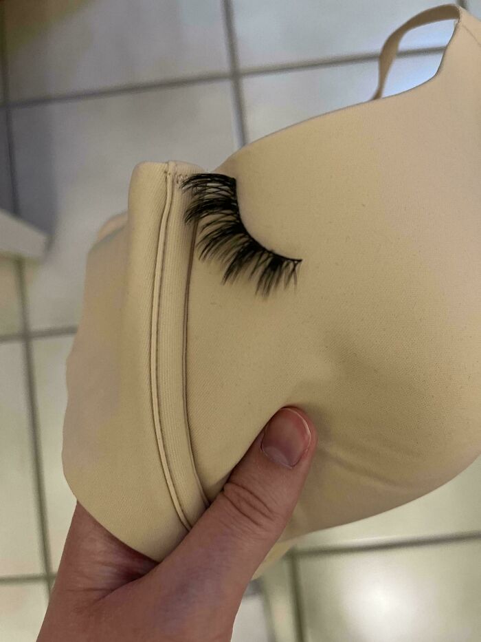 Beige bra with attached false eyelash showcasing a funny careless online shopping backfire.