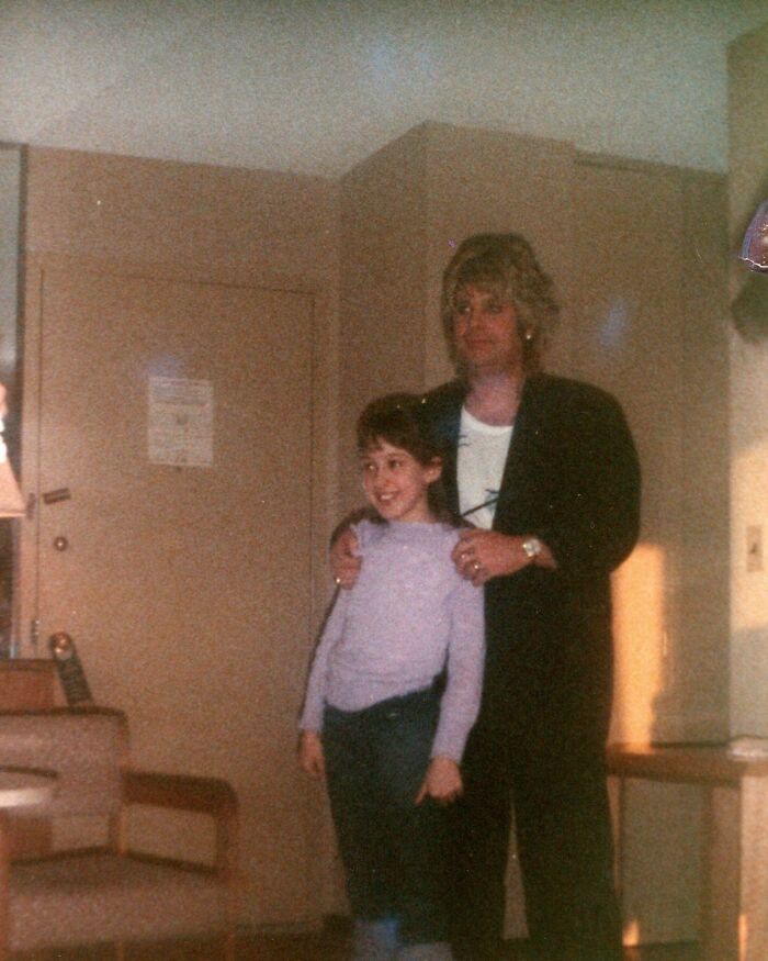 Woman and child posing in a vintage indoor setting, capturing a warm moment from the wild and wonderful 1980s era.