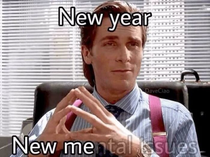 Man in office with hands steepled, captioned new year new me, representing psychology memes on the human mind.