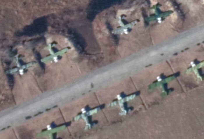 Aerial view of abandoned airplanes captured on Google Earth showing unexpected objects along an empty runway.