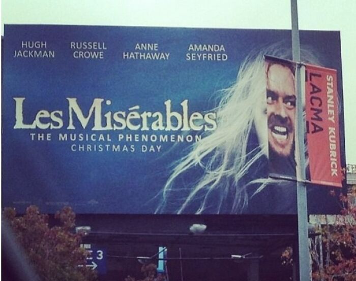 Les Misérables billboard humor obscured by a Stanley Kubrick LACMA banner creating an accidental comedy moment.