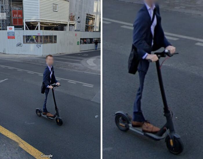 Person in business attire riding an electric scooter on street captured unexpectedly by Google Earth and Maps.