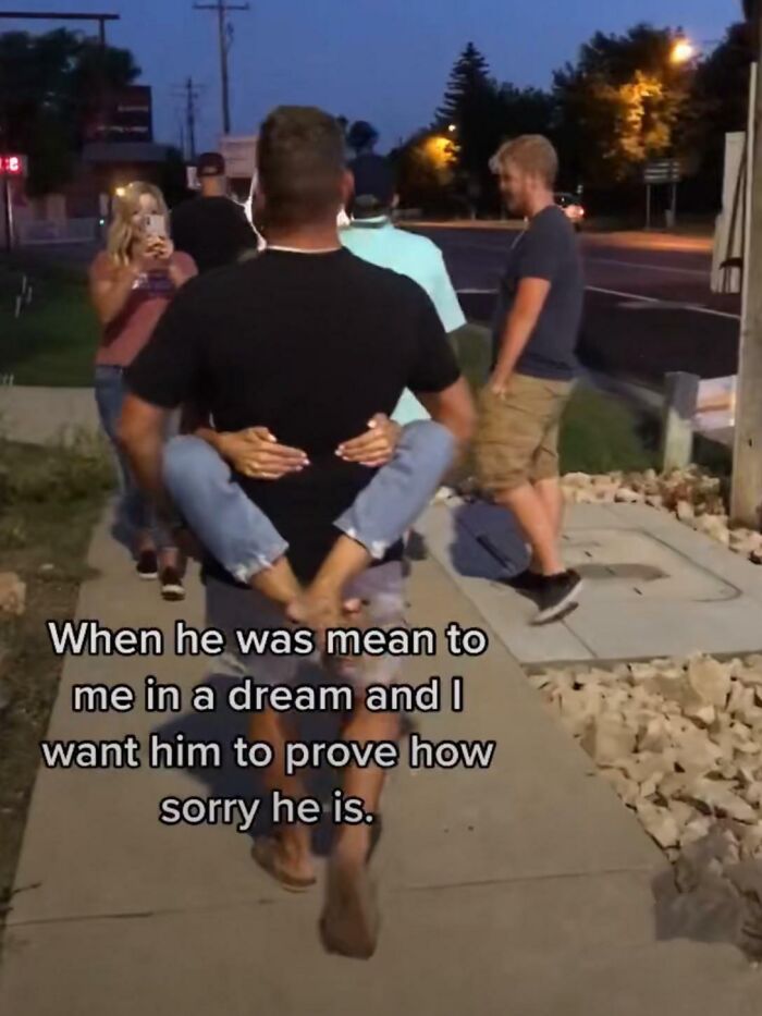 Couple walking outside at night with woman clinging to man and caption about unhinged things women said.