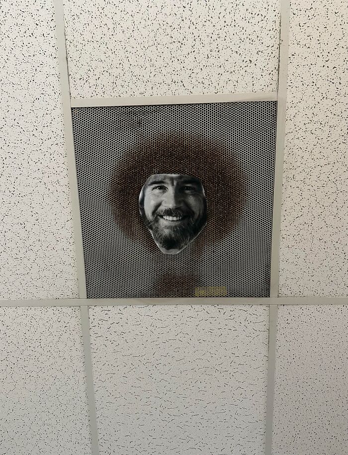 Ceiling vent with a smiling doctor’s face cutout, creating a humorous and wholesome patient comfort moment.