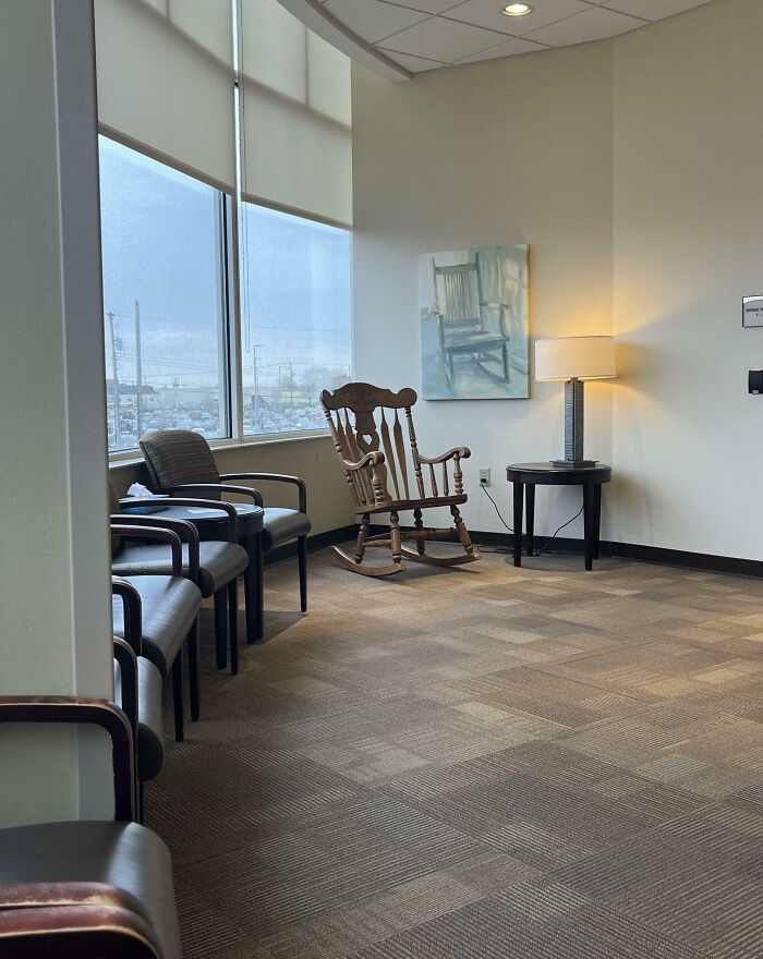 Waiting room with a wooden rocking chair and cozy lighting, one of the wholesome things doctors did to ease patients.