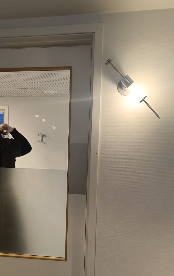 Wall light fixture designed to look like a large nail, showing a hilarious and wholesome doctor idea to ease patients.