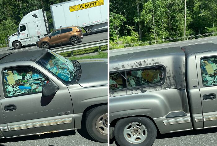 Pickup truck with windows completely filled with messy clutter, showing a mildly infuriating scene testing patience.