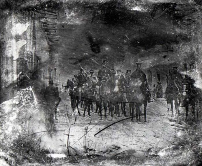 Black and white historic photo showing soldiers on horseback, a rare image from the early time photography was a new phenomenon.