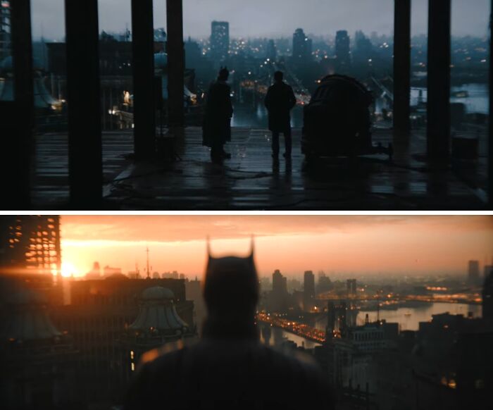 Dark, mysterious cityscape with two people and Batman overlooking an imaginary world at sunset and night.
