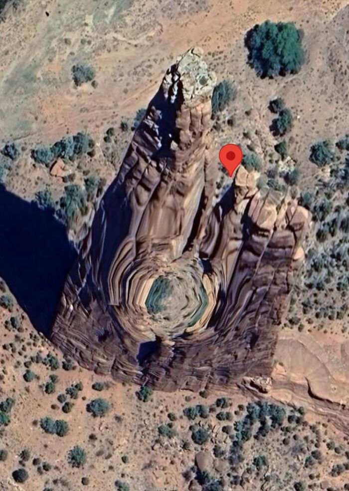 Distorted rock formation in a desert landscape seen in Google Earth and Maps capturing unexpected natural patterns.
