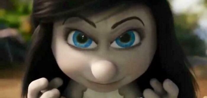 Close-up of an animated character with blue eyes highlighting confusing bad movie details in an online group discussion.