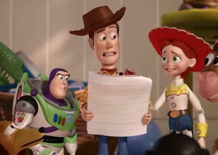 Animated characters from Toy Story examining confusing bad movie details in an online group dedicated to movie fans.