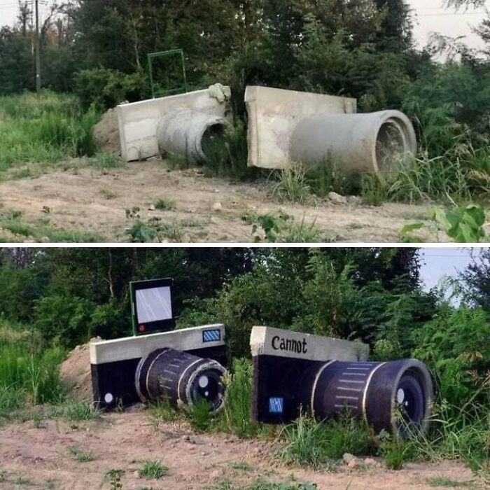 Street art creatively transforms concrete pipes into a broken camera in a natural outdoor setting.